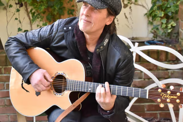 Acoustic guitar performer